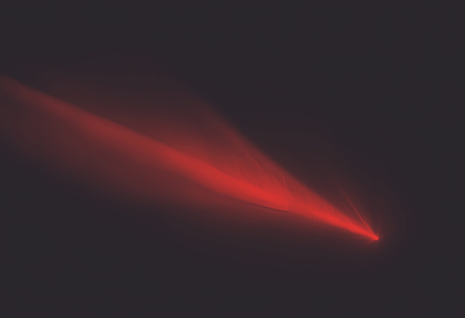Red light beam in a dark venue