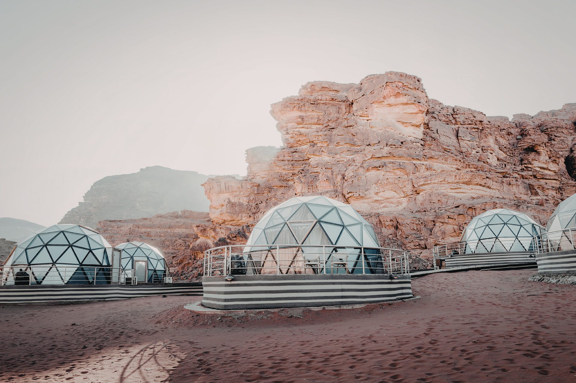 Glass geodesic domes in a desert canyon